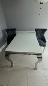 table and 2 plush velvet knocker chairs