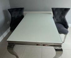 table and 2 plush velvet knocker chairs