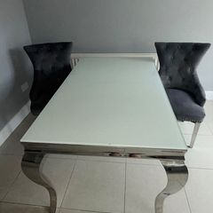 table and 2 plush velvet knocker chairs