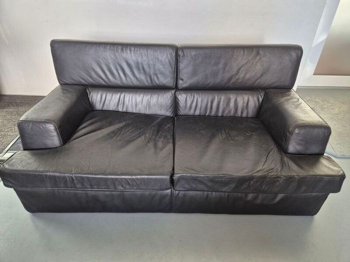 1 contempory leather sofa with arm chair