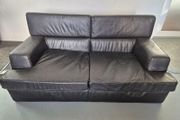 1 contempory leather sofa with arm chair