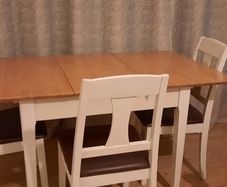 As new Extendable kitchen table and soft padded chairs