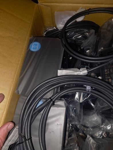 16 x Logitech Swytch Hubs. Includes power adapters and a few Extenders