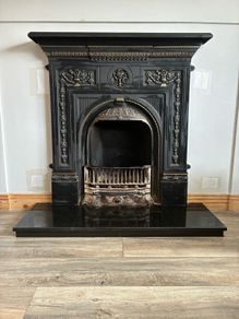Beautiful ornate fire surround, cast Iron. Granite hearth and fire front. Very good condition