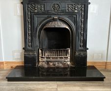 Beautiful ornate fire surround, cast Iron. Granite hearth and fire front. Very good condition
