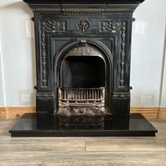 Beautiful ornate fire surround, cast Iron. Granite hearth and fire front. Very good condition