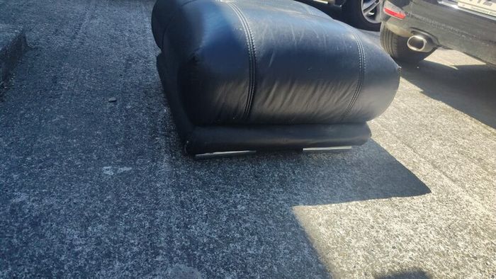 black leather footstool