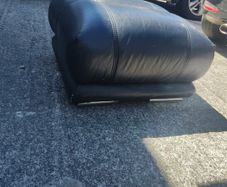black leather footstool