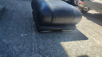 black leather footstool