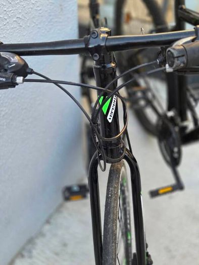 Two bikes one mountain one is a type of racing mountain bike