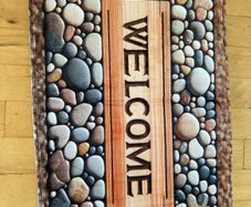 Mat with Welcome on it . Stones design on it. 76 x 50cm