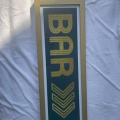 Gold framed bar sign