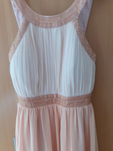 Occasional dress worn once and cleaned Slight emblishment on straps chest and waist .Slightly padded at bust so no need for a bra ..Knee length .25 euro paid 95 .