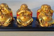 Three brass Buddha figurines