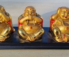 Three brass Buddha figurines