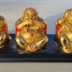 Three brass Buddha figurines