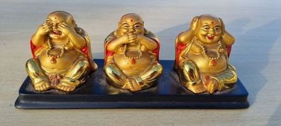Three brass Buddha figurines