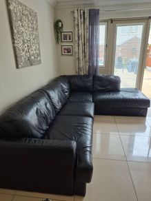 Black leather corner sofa and recliner chair