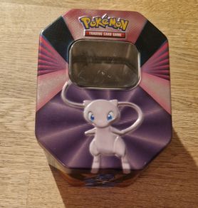 Pokemon Tin and 60 Pokemon cards