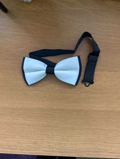 White with black bow tie