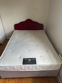 Double bed with mattress and headboard