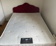 Double bed with mattress and headboard