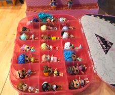 lol bundle, 33 dolls, storage case and display stand.