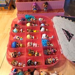lol bundle, 33 dolls, storage case and display stand.