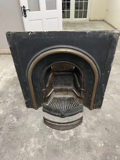 Victorian-style cast iron fireplace insert, surround and hearth