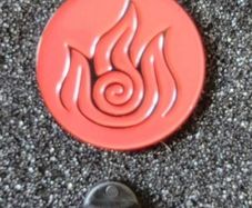 Celtic fire symbol , pin back badge.