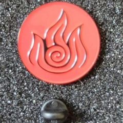 Celtic fire symbol , pin back badge.