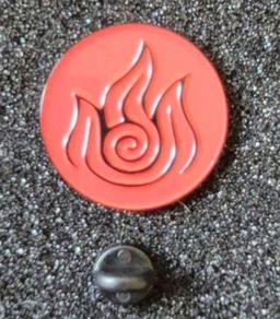 Celtic fire symbol , pin back badge.