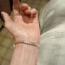 Silver tone bracelet with blue stones and words on it Image 7