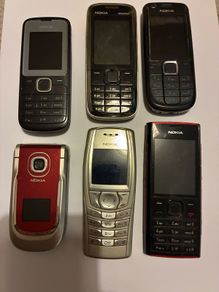 Six vintage Nokia mobile phones.