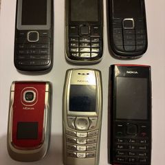 Six vintage Nokia mobile phones.