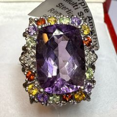 A beautiful silver ring with an amethyst and multi-stone.