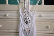 White top with pattern on it