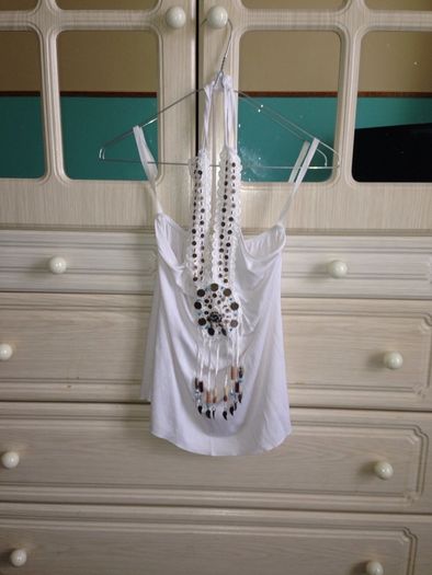 White top with pattern on it