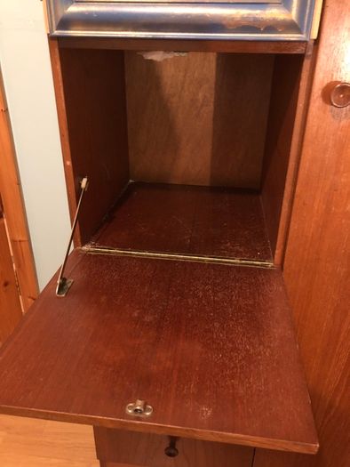 Wooden wardrobe with drop-down door and drawers