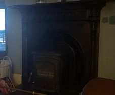 Wood burning stove and mantel