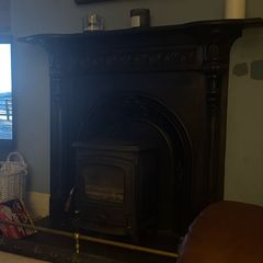 Wood burning stove and mantel