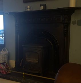 Wood burning stove and mantel