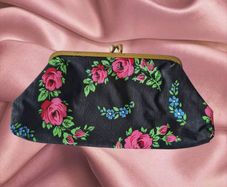 Vintage 1960s black purse with floral pattern pink green lipstick make up brass clasp retro