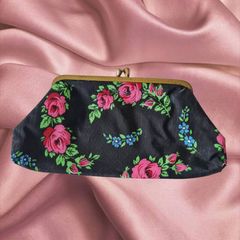 Vintage 1960s black purse with floral pattern pink green lipstick make up brass clasp retro
