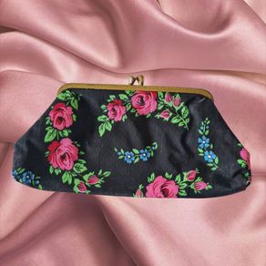Vintage 1960s black purse with floral pattern pink green lipstick make up brass clasp retro
