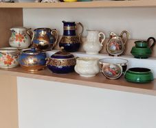 Collection of vintage milk pitchers and matching sugar bowls