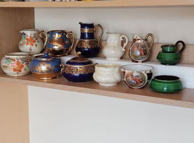 Collection of vintage milk pitchers and matching sugar bowls