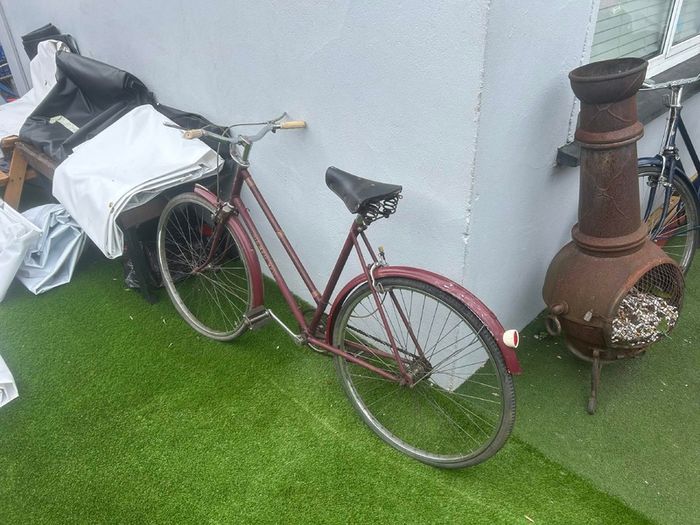 Vintage Triumph roadster (maroon, ladies step-through)