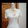 A. Wear white 100% cotton wrap over cardigan. Image 4