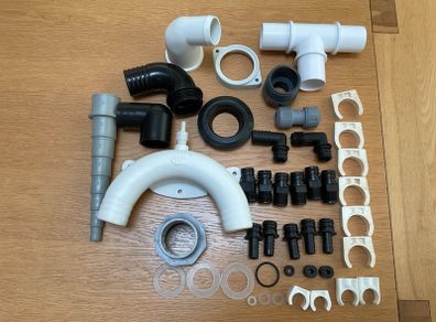 Selection of plastic fittings for plumbing systems on boats.